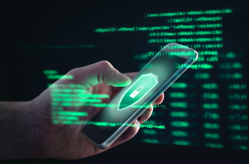 Man using a phone which shows the debate between data privacy and consumer convenience in FinTech
