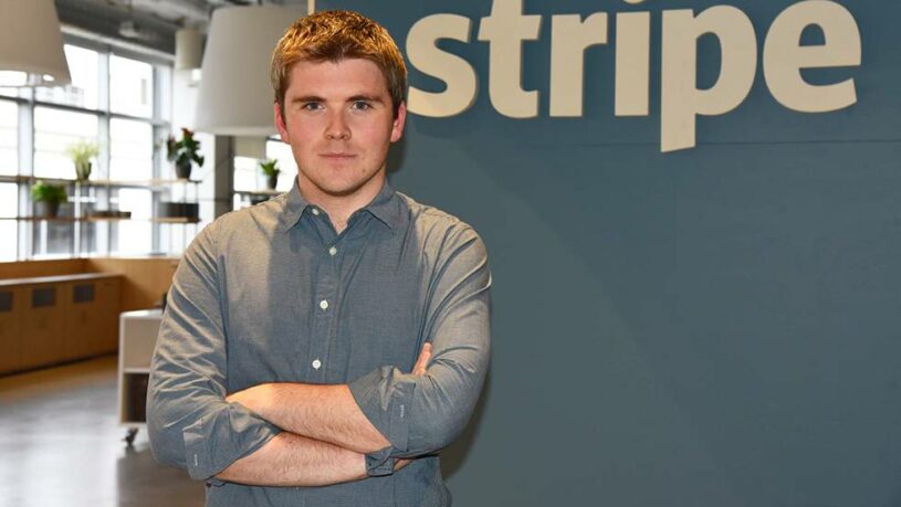 John Collison, Stripe co-founder, standing in the Stripe headquarters