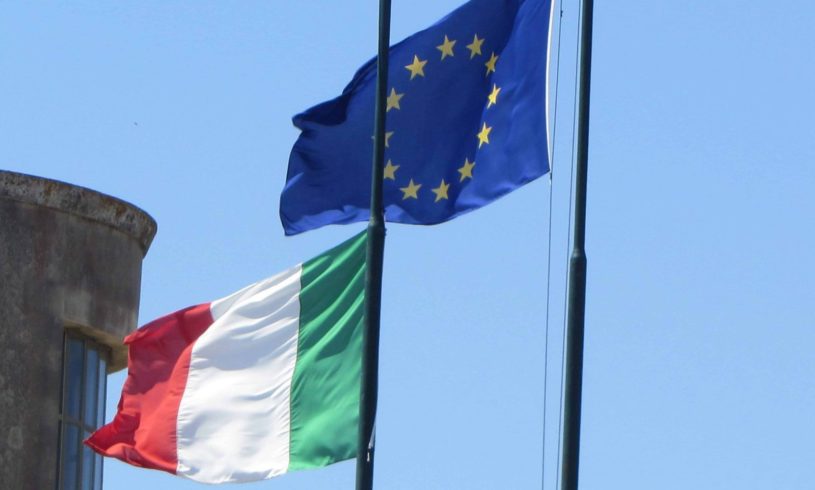 Italian Flag and EU Flag waving in the wind