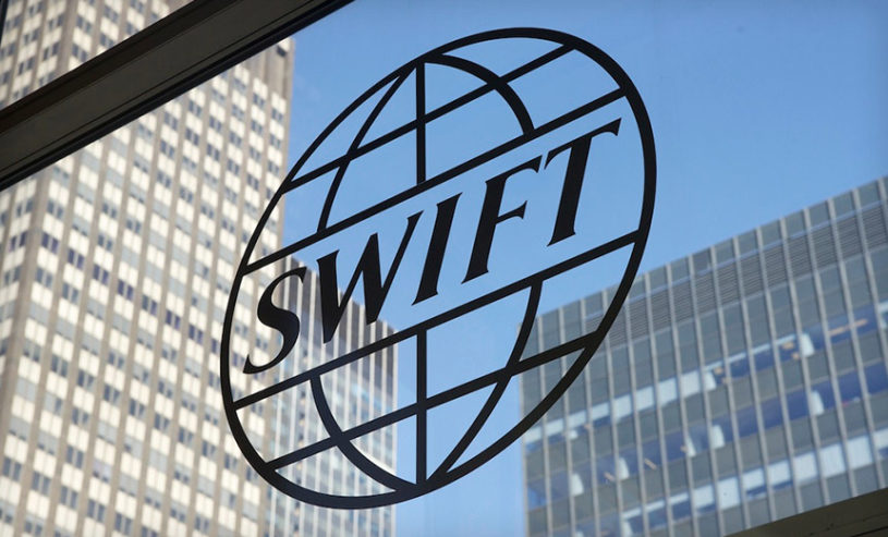 SWIFT payment transfers logo in a building window