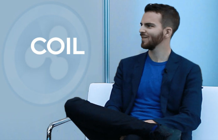 Coil CEO sitting down in white chair with business casual dress and talking about fintech
