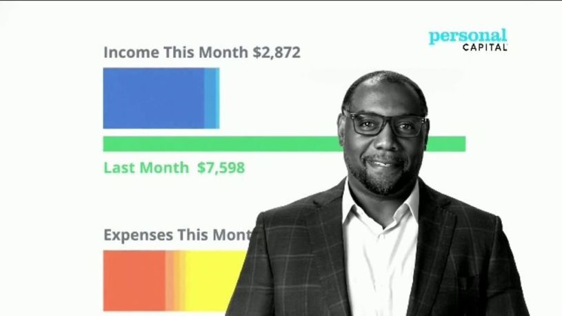 High net worth investor wearing a business suit and using personal capital's robo advisory service