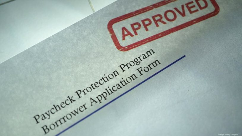 Piece of paper that says PPP loan application with red stamp "approved".