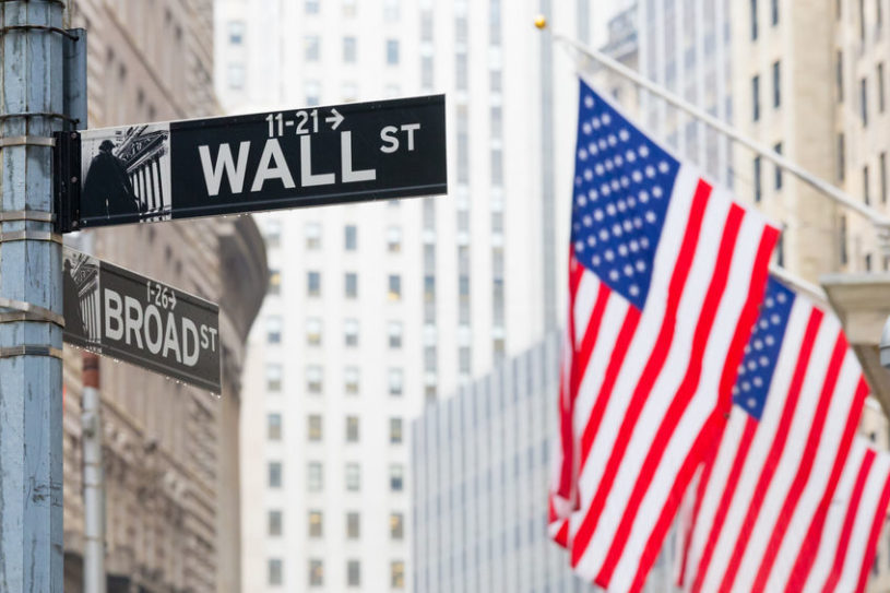 Wall Street street signs and American flags
