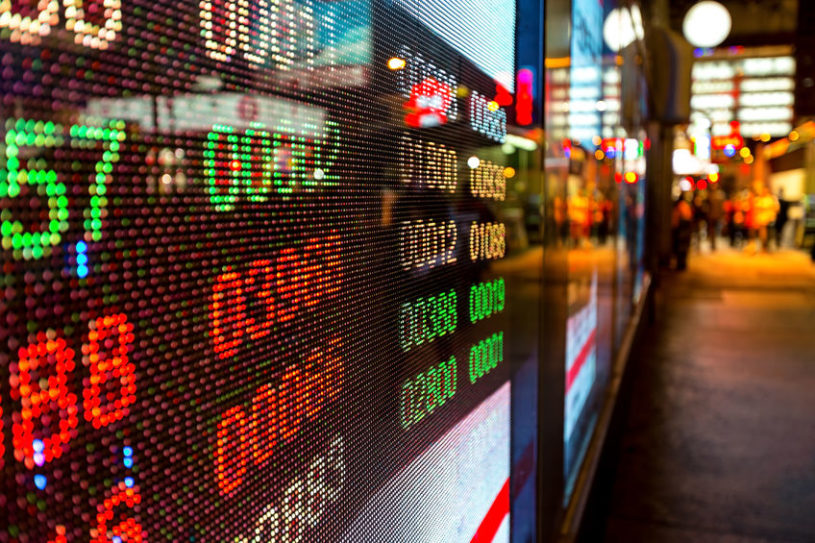 Wall Street with digital stock sign showing the best penny penny stocks to buy