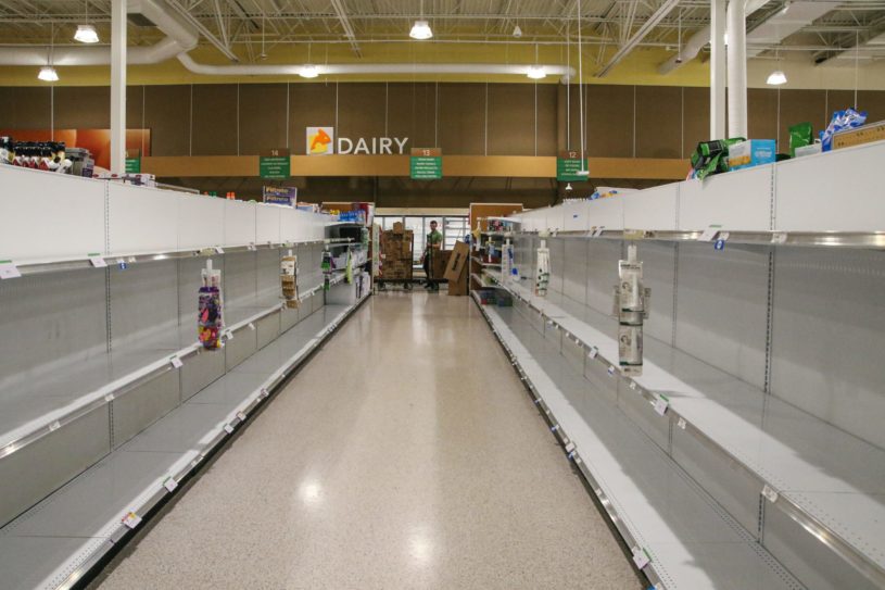 Empty grocery with empty shelves due to a stock market crash.