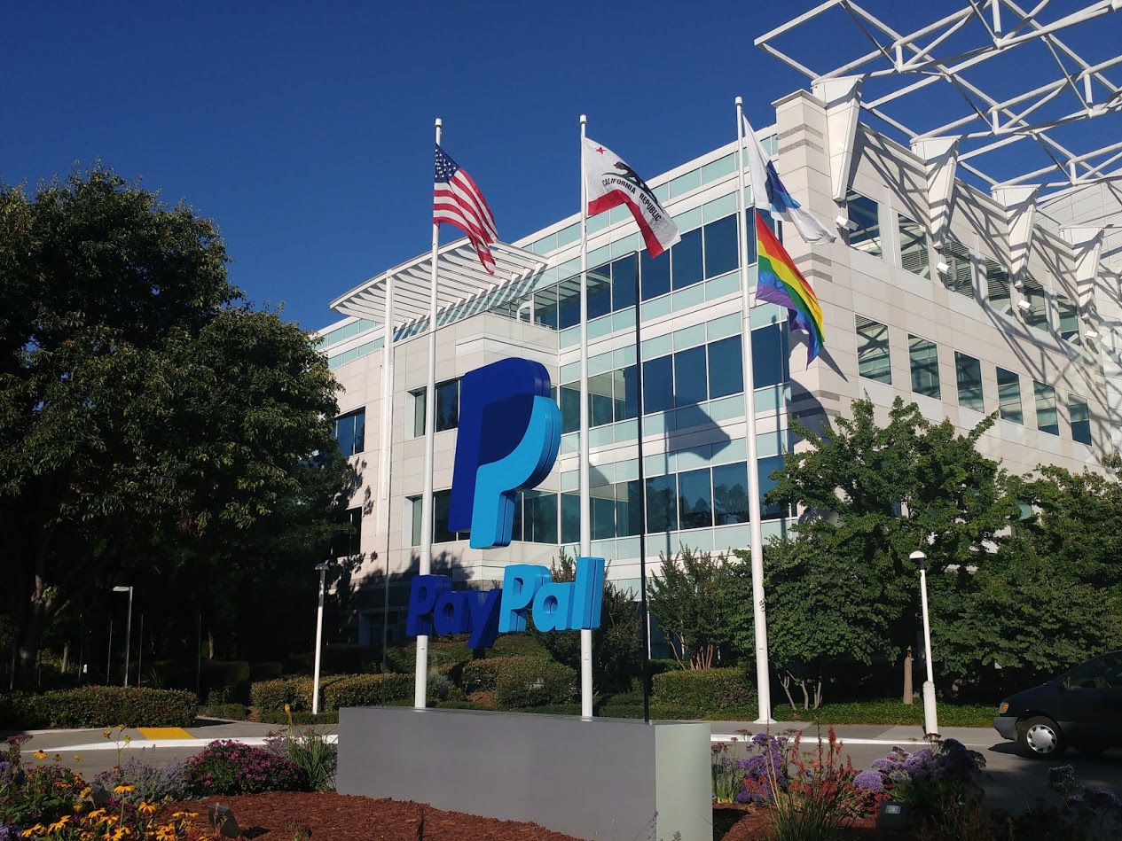 PayPal's San Jose office with a huge cut out of the company's logo in front of it.