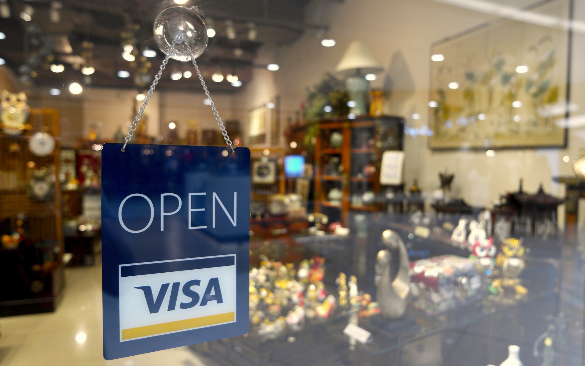 Open sign with Visa logo on it.