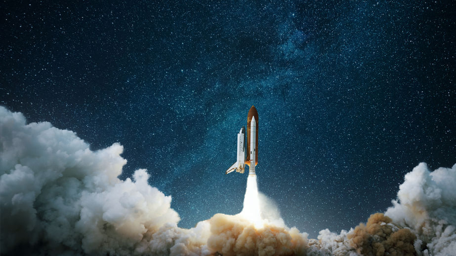 A spaceship lifting off toward the moon in a dark sky to depict Bitcoin's unprecedented rise.