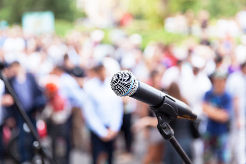 Microphone in front of a crowd of people