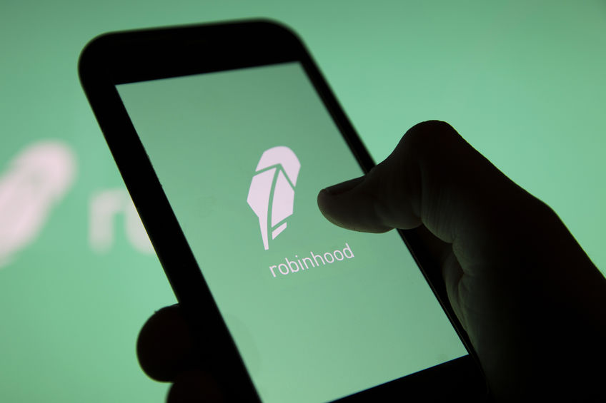 Robinhood app open on smartphone with Robinhood image displayed on screen and in background.