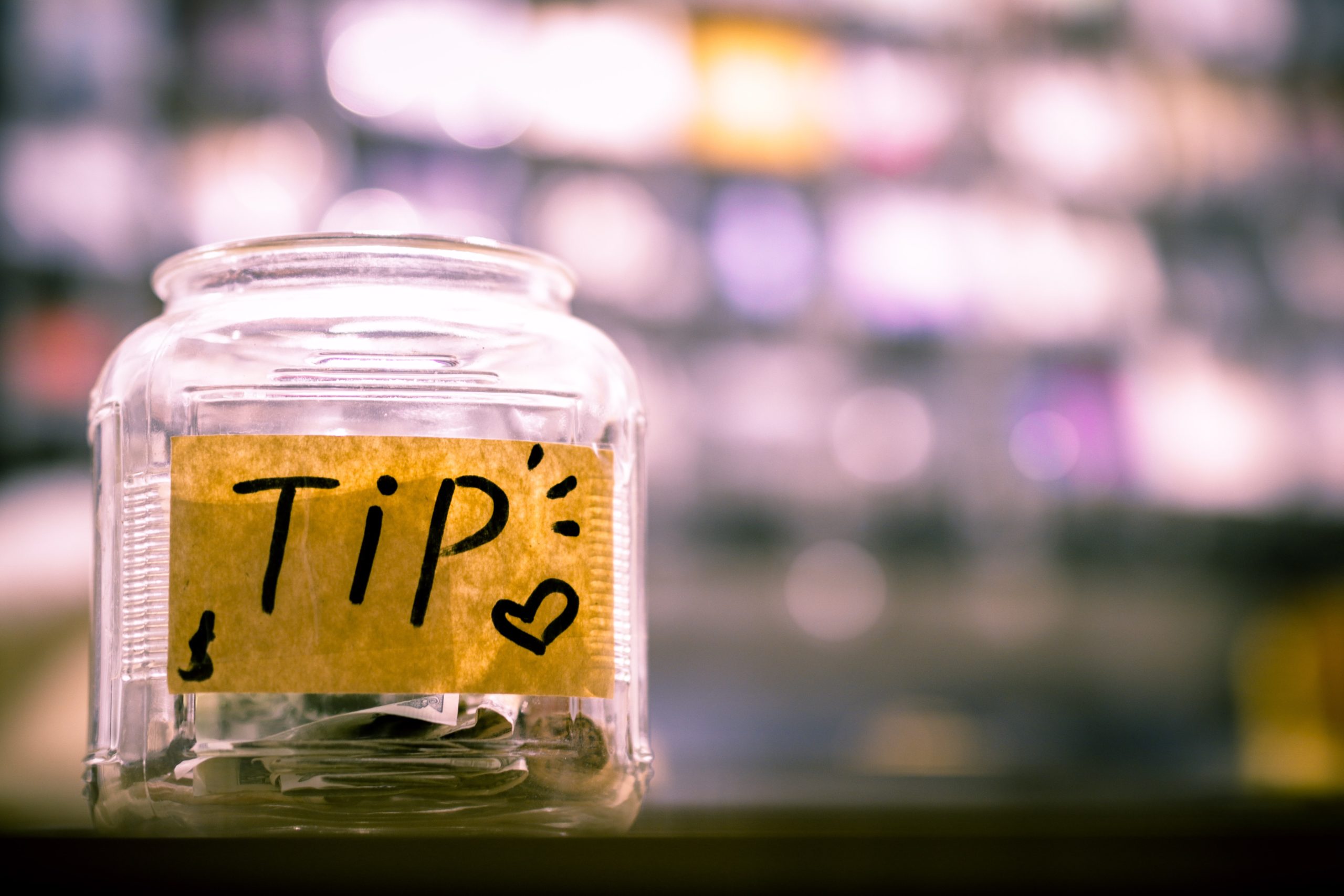 Half-full tipping jar waiting to be filled.