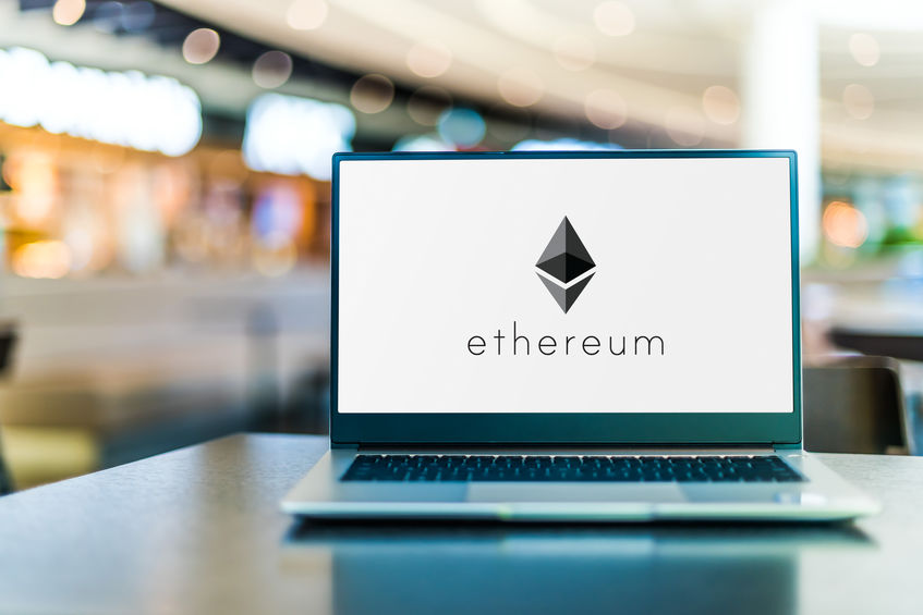 Laptop with Ethereum logo shown with a blurry background