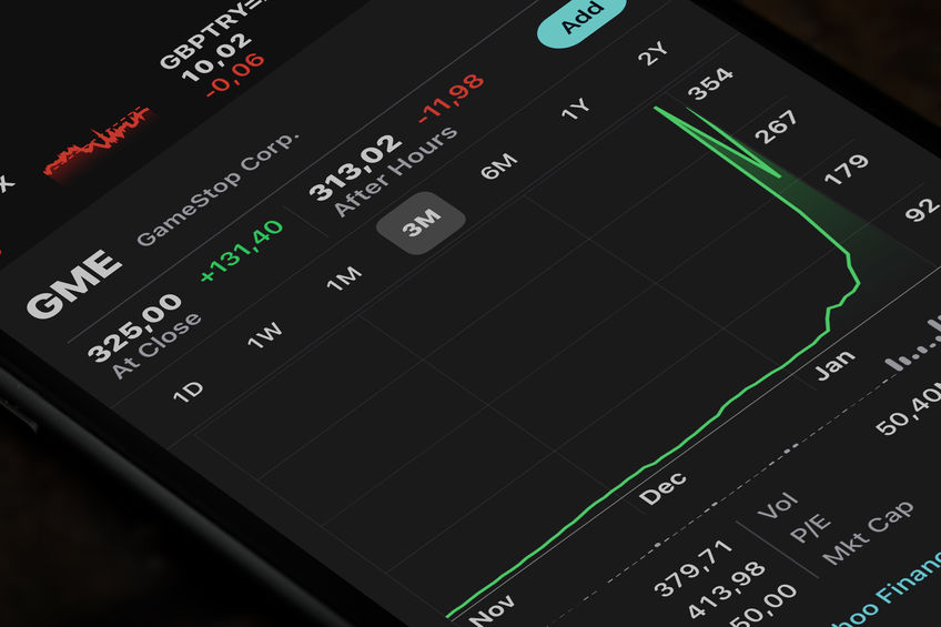 Gamestop stock action shown with a price chart on a smartphone with a black background.