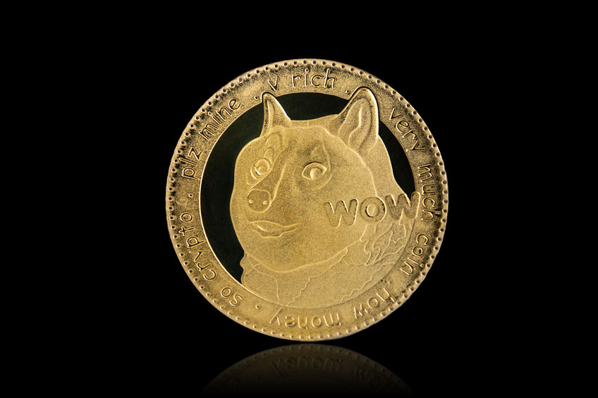 Isolated with clipping path, the golden DOGE Coin symbol close up. Doge coin is one of the digital currency - cryptocurrency driven by blockchain technology.