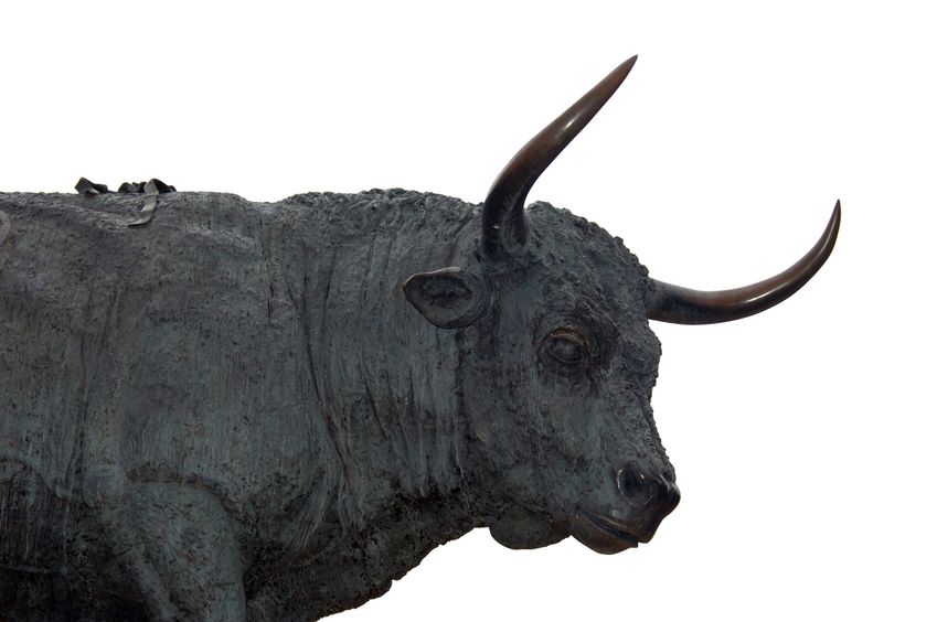 Large statue of a bronze bull, signifying a Bitcoin bull run.