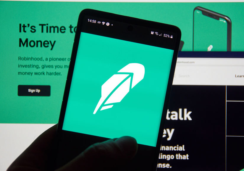 Robinhood app and logo on screen. Robinhood financial services company. The company offers mobile app and website that offers people the ability to invest in stocks