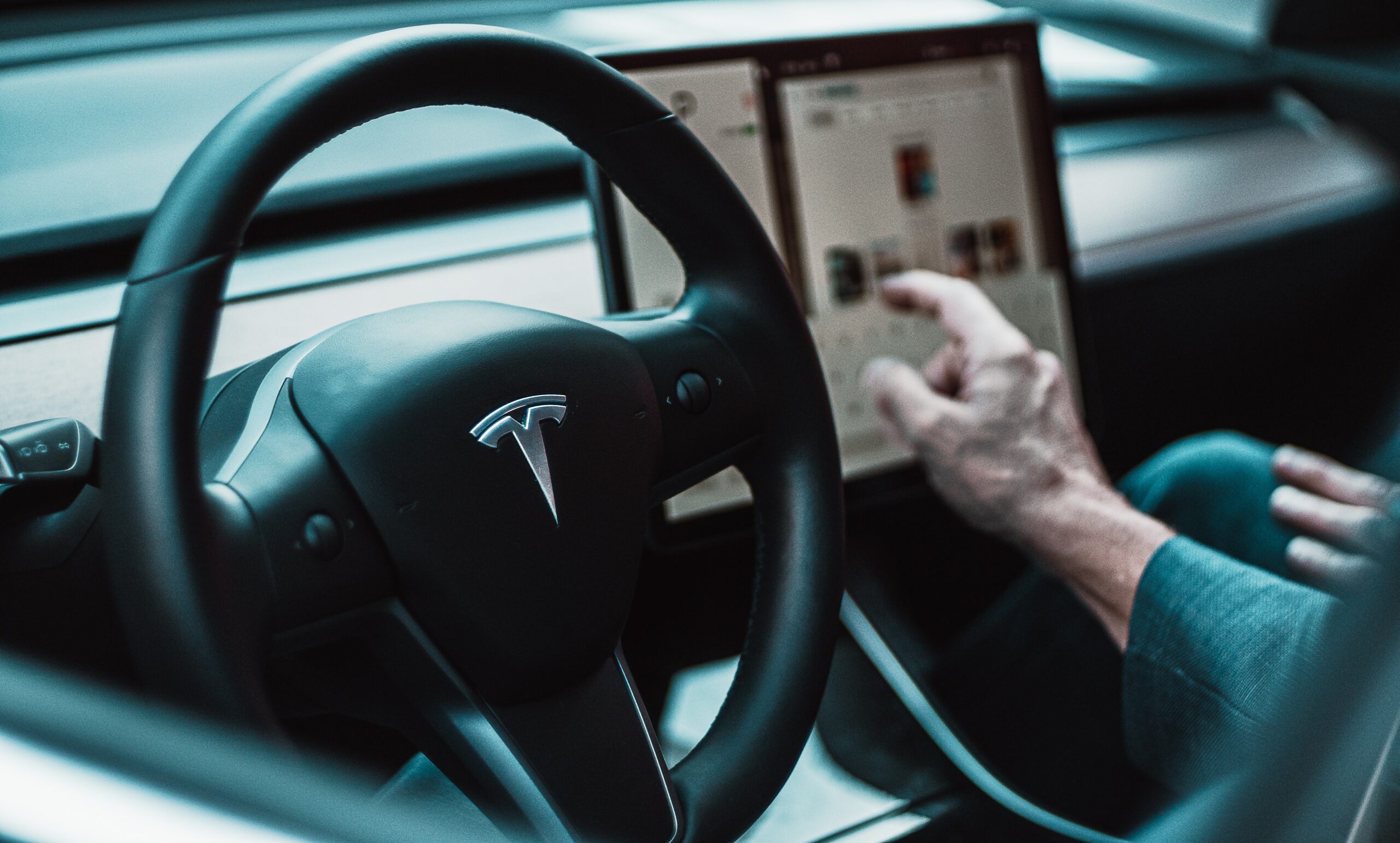 Image of interior of a Tesla car, signifying the fact that Tesla make a loss on their vehicle production