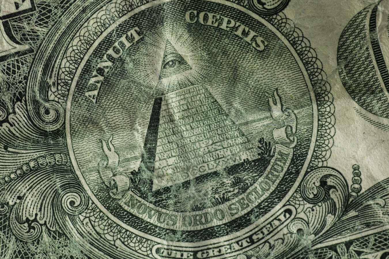 Close up zoom of USD to its curious origin.