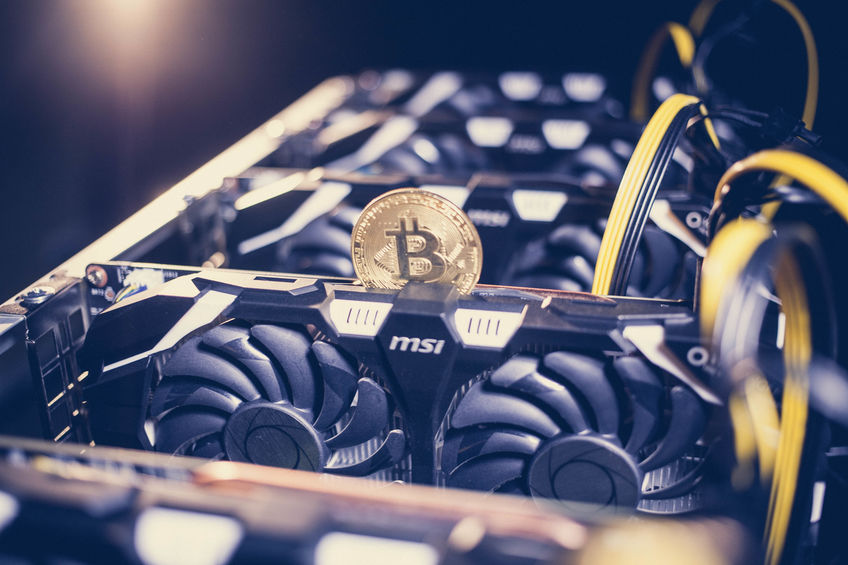 Bitcoin mining rigs in a warehouse in China.