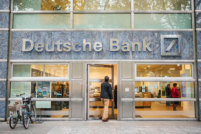 Unknown man walks into the beautiful glass office of Deutsche Bank