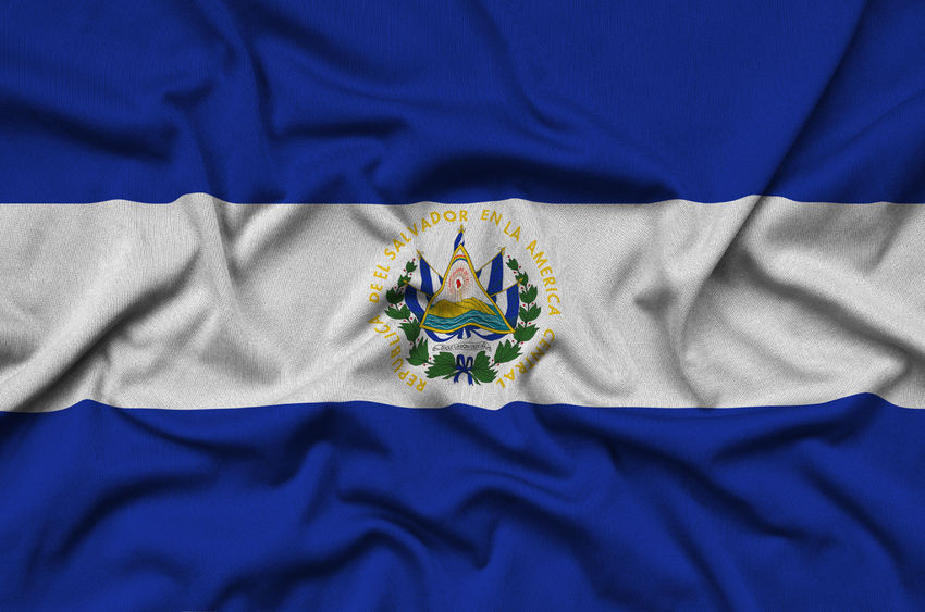 el salvador flag is depicted on a sports cloth fabric with many folds. sport team waving banner