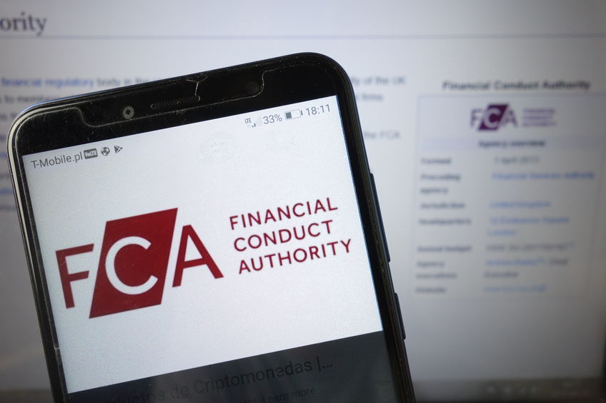 FCA Financial Conduct Authority logo displayed on mobile phone