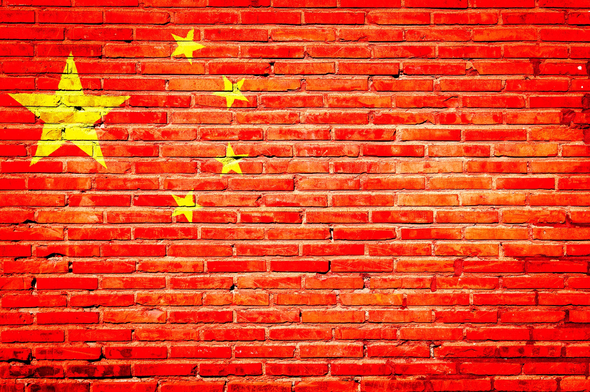 The national flag of China painted on a wall.