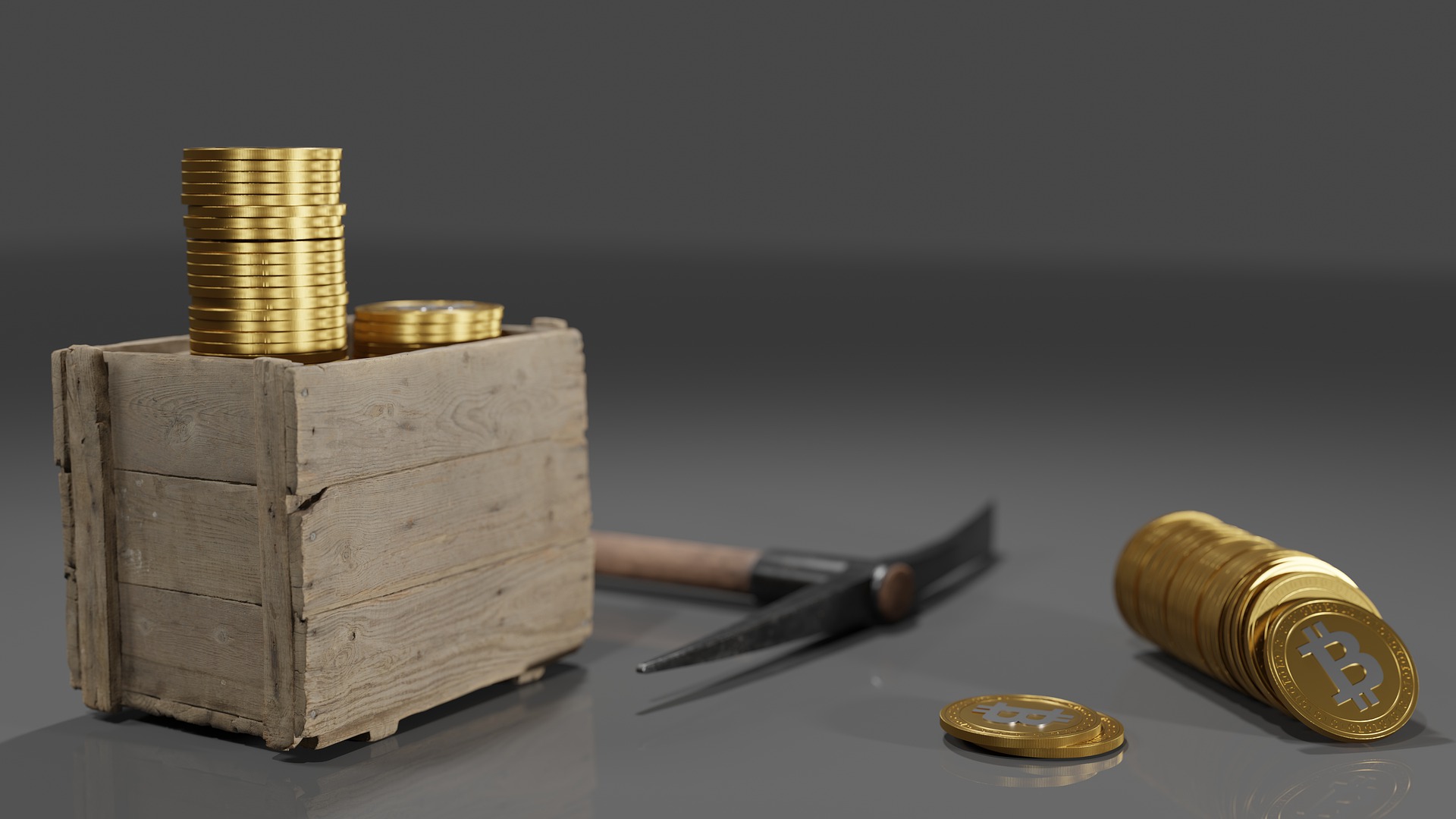 Several bit coins with a hammer.