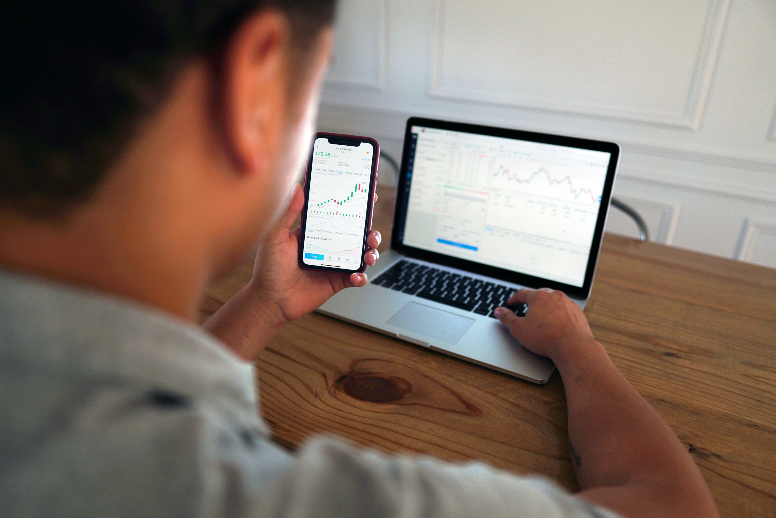 Young casual trader examining the price action of Bitcoin.