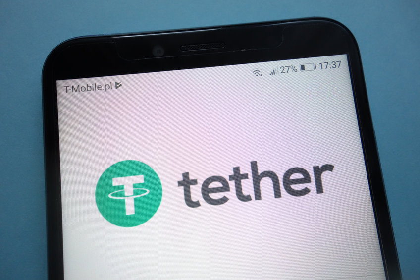 Cell phone showing a screen that reads "tether" in black lettering