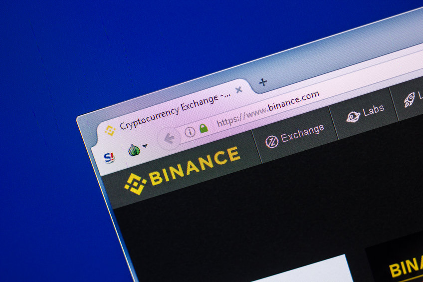 Homepage of Binance website on the display of PC, url - Binance.com.