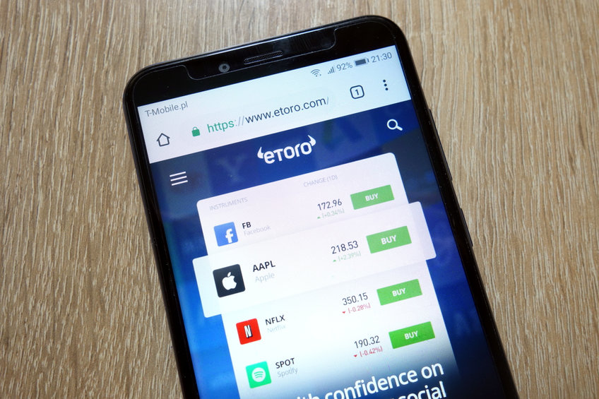 eToro website (www.etoro.com) displayed on smartphone