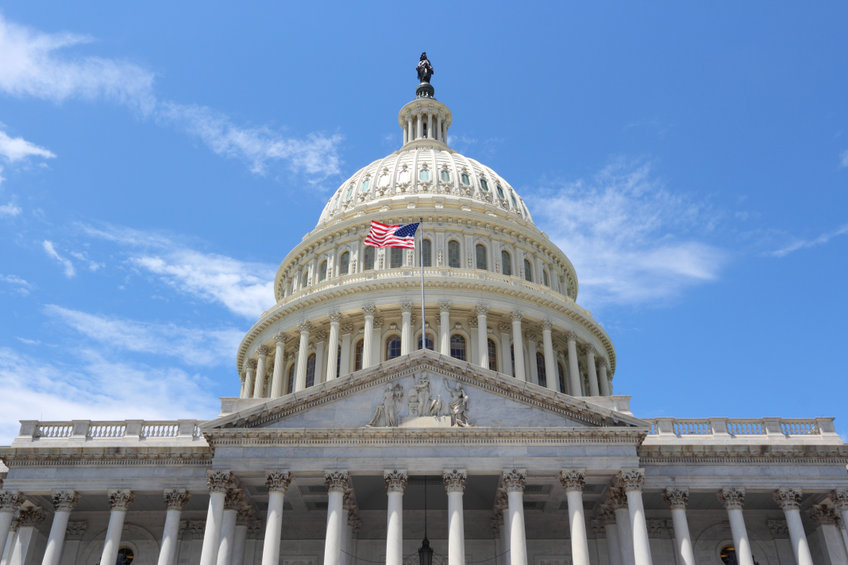 National Capitol building with US flag.
