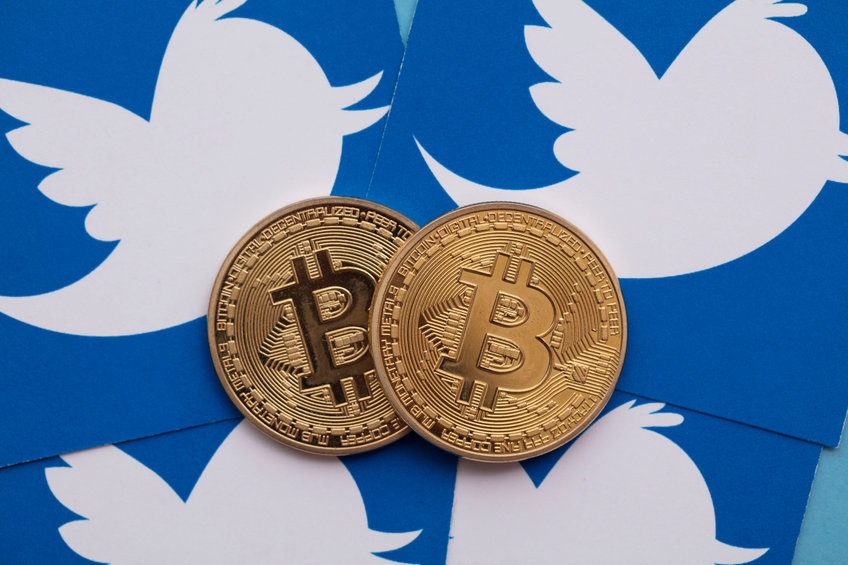 Image of bitcoins on top of Twitter logos