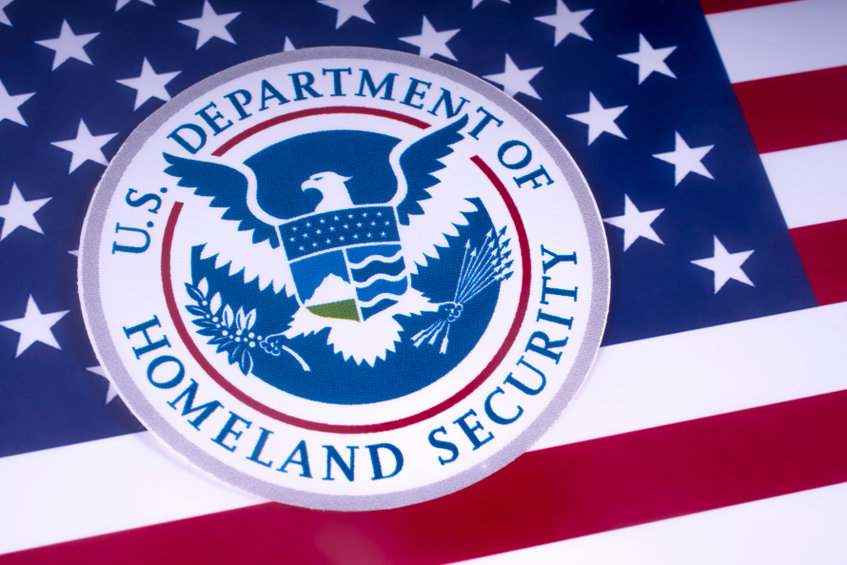 Image of the US flag with the Homeland Security crest