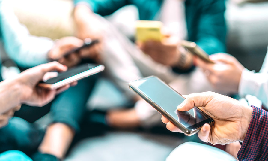 Image of a group of people on their phones