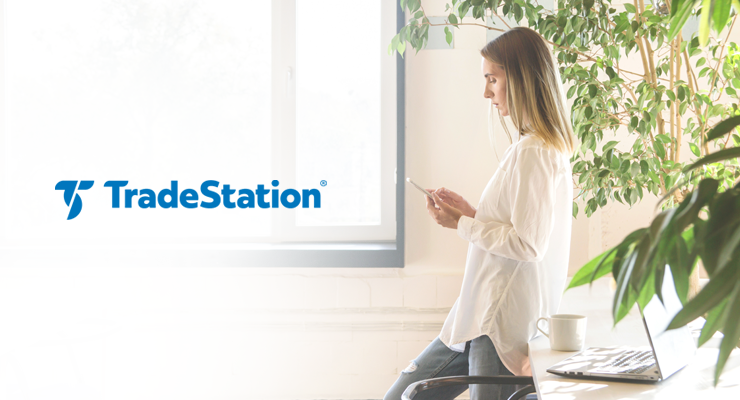 Young woman using TradeStation to trade stocks