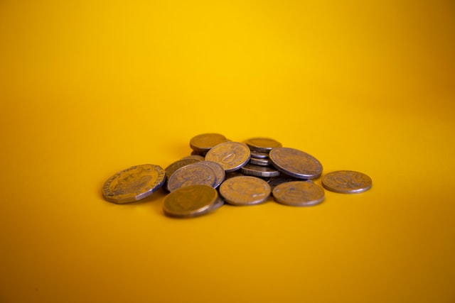Image of coins with yellow background