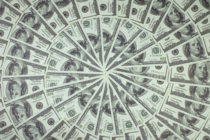 Group of money stack of 100 US dollars banknotes a lot of is arranged in a beautiful circle, representing the amount of capital invested in crypto by Venture Capitalists.