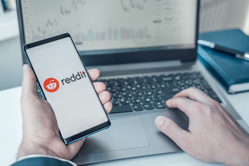 Image of a phone with the Reddit app