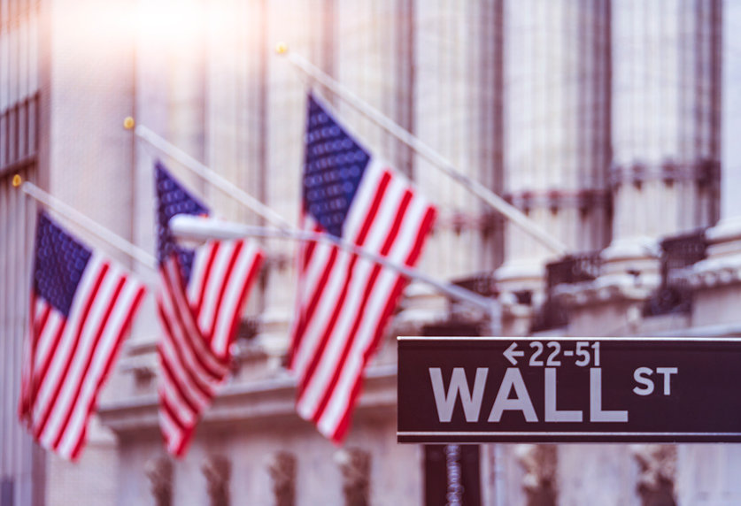 Image of US flags outside Wall Street