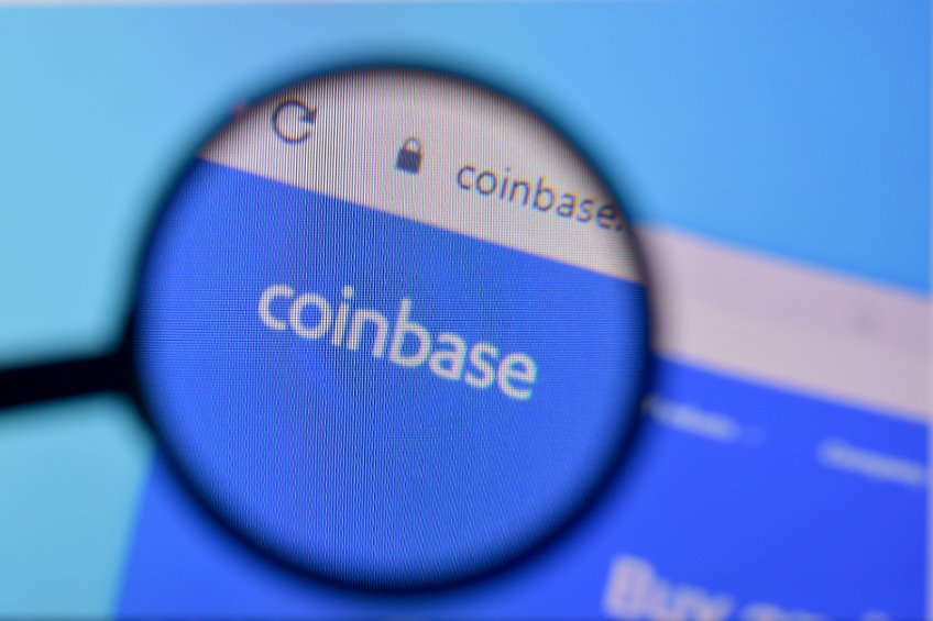 Image of coinbase's homepage with company's logo under a magnifying glass.