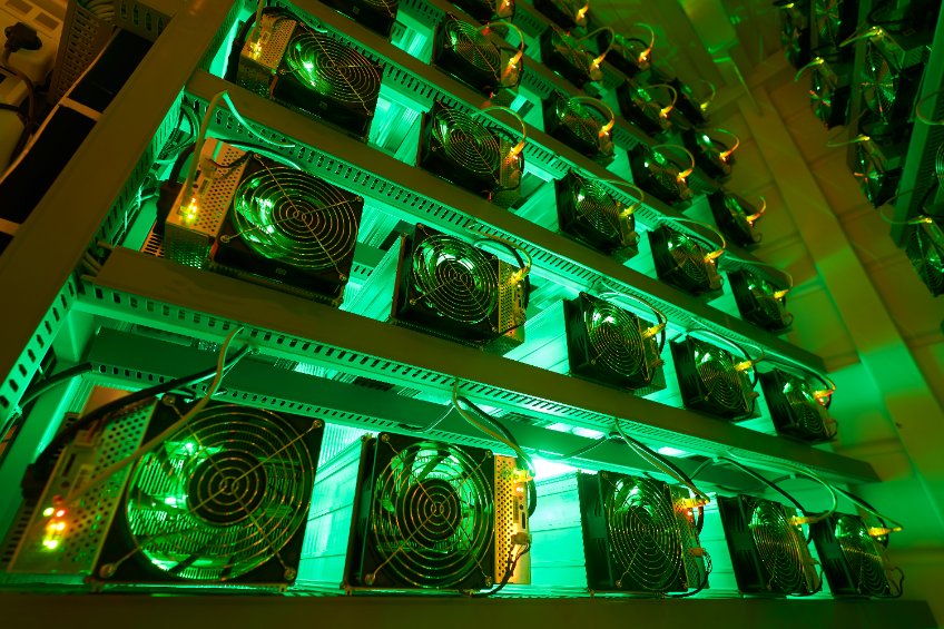 Bitcoin miners in large farm, asic mining equipment