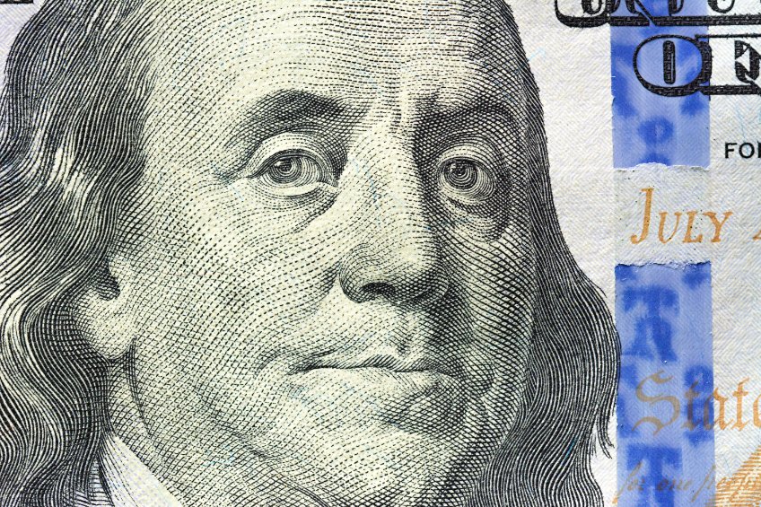Close up of benjamin franklin face on 100 us dollar bill