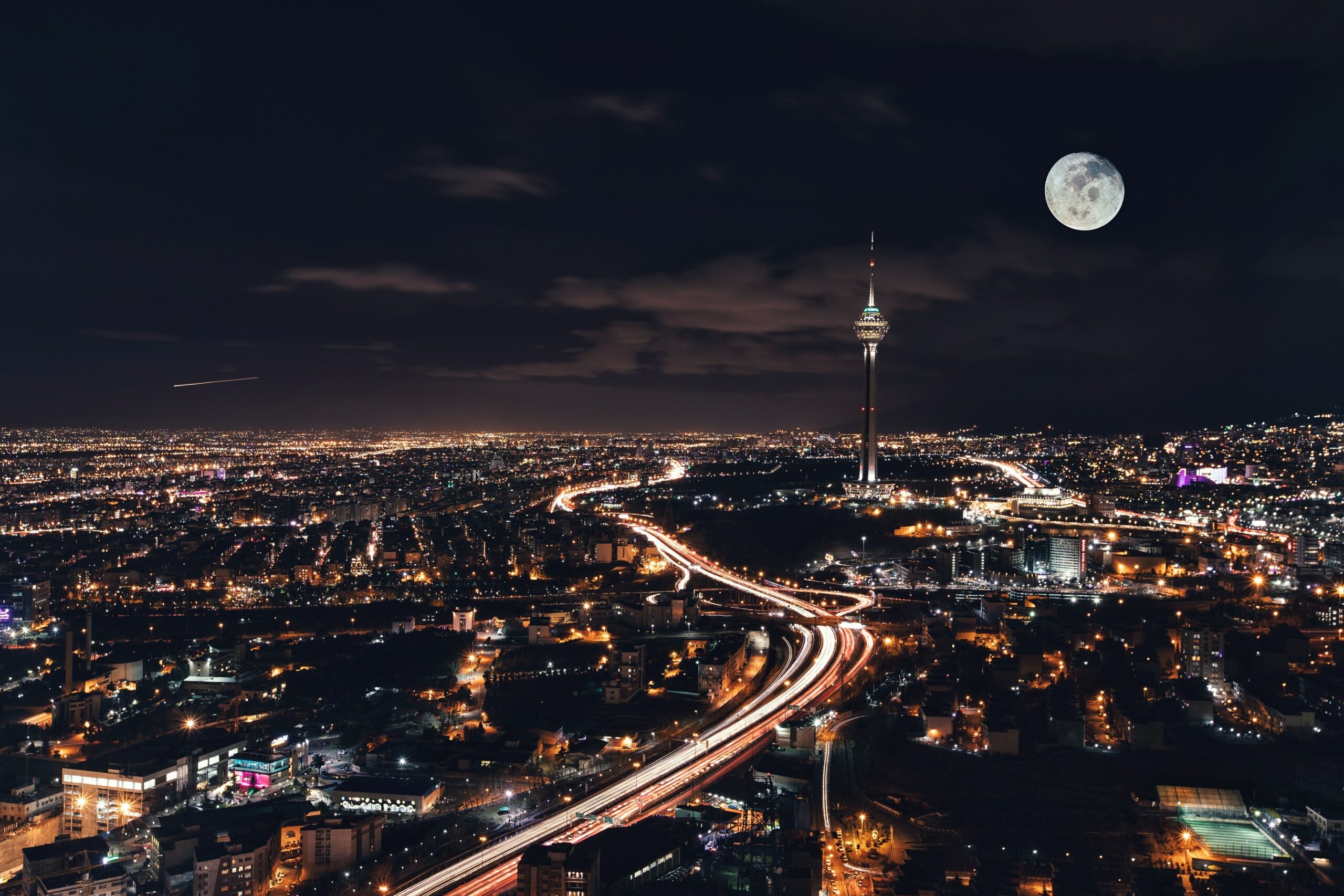 Overview of Tehran, Iran at night with Milad Tower visible.