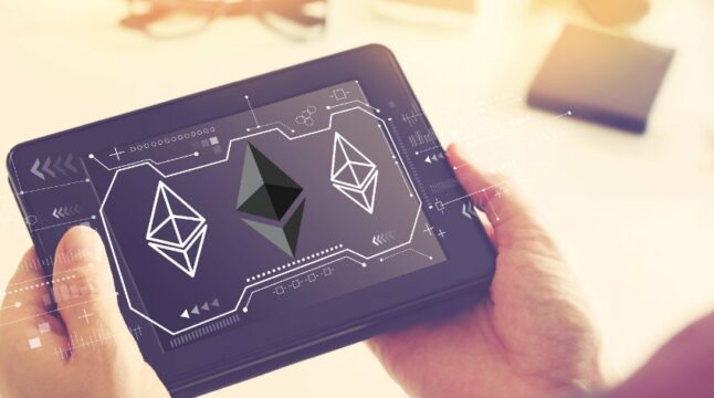 Ethereum Logo on Tablet Held in Hand