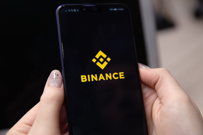 apple iphone and binance logo