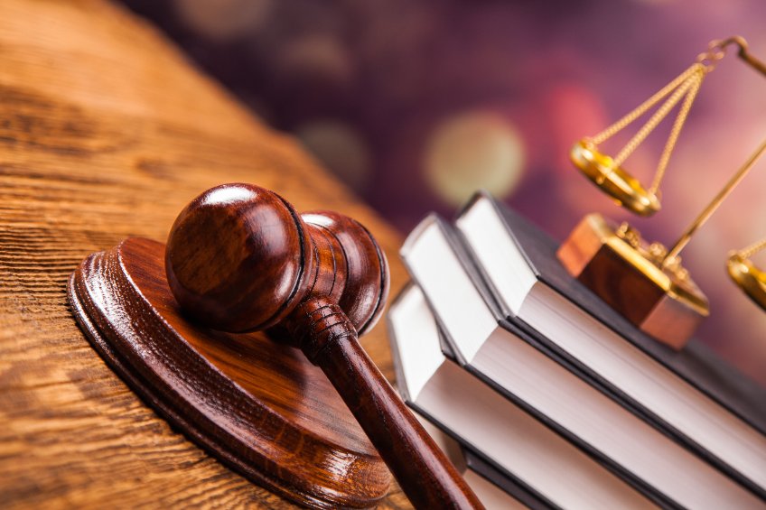 Mallet, legal code and scales of justice.