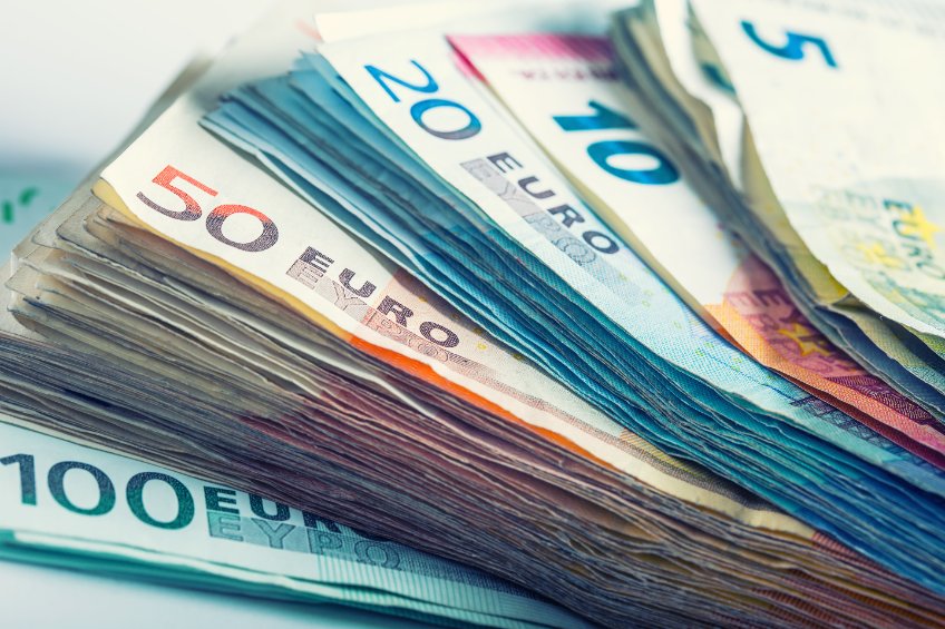 Several hundred euro banknotes stacked by value